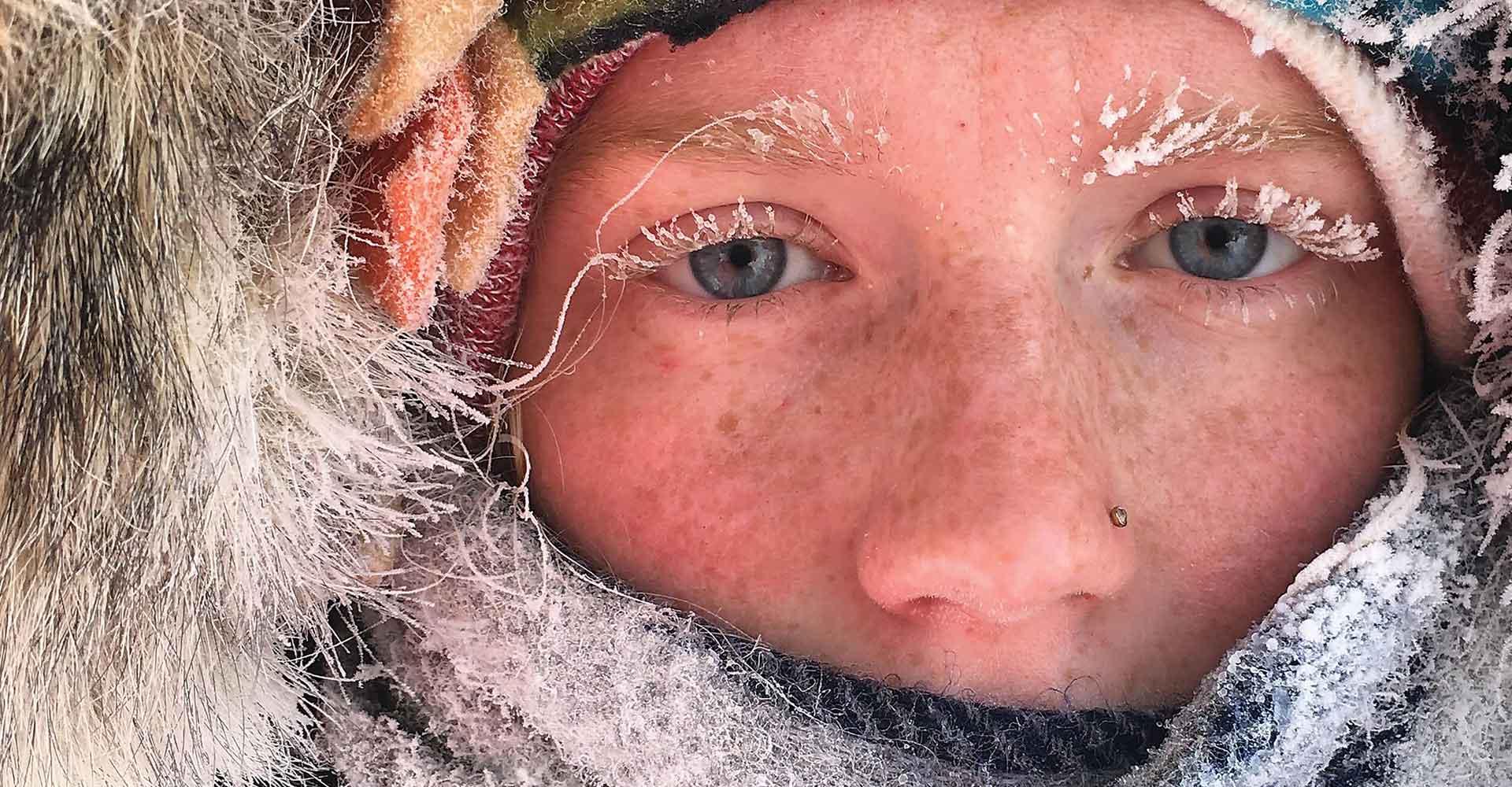 Close up of Agnes Scott Summit student's face, in a parka with frost on their eyelashes.